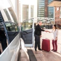 Airport Shuttle driver and passengers in a big city